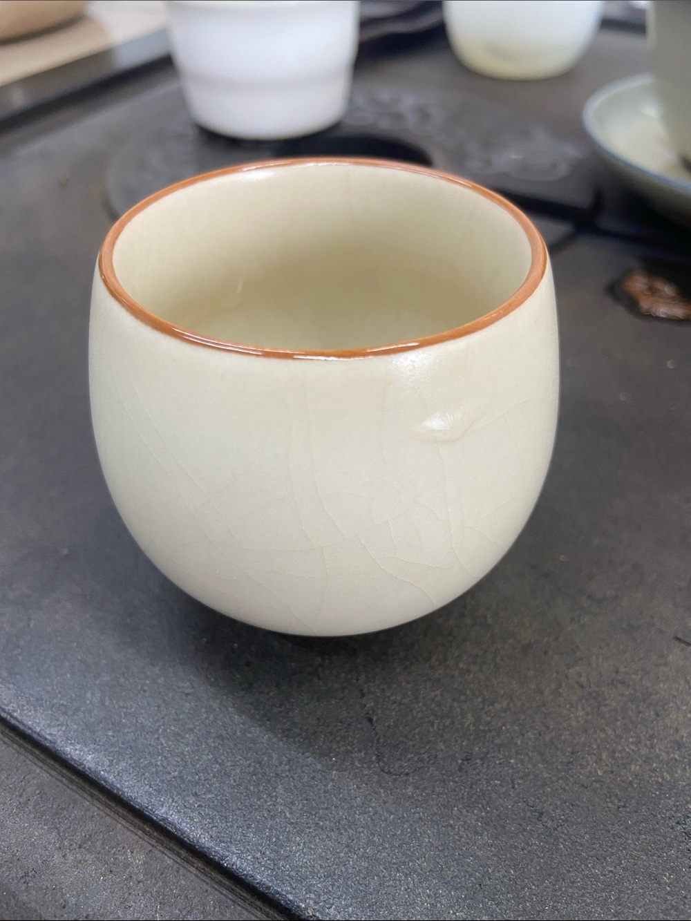 Handcrafted Cream Ceramic Cup with Brown Rim